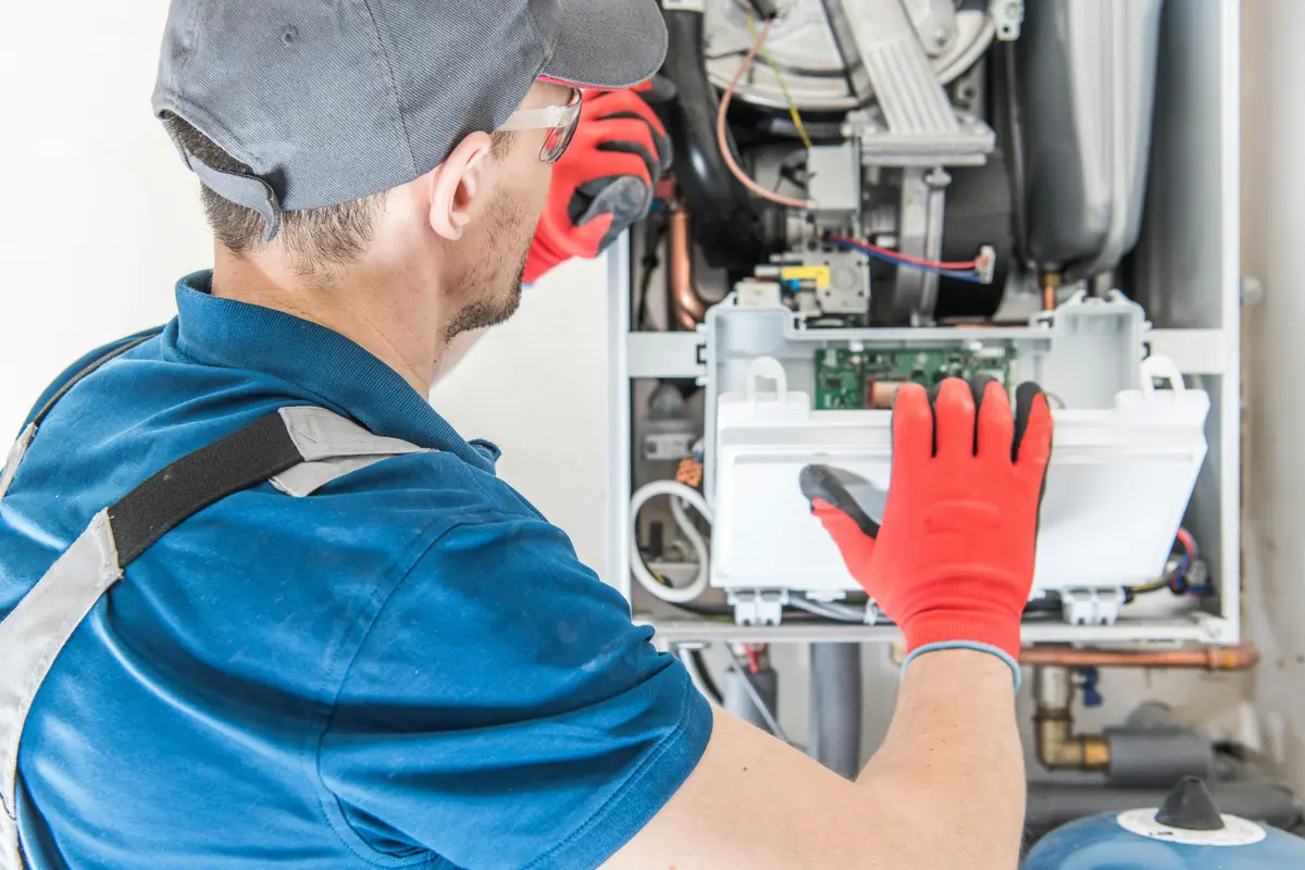 HVAC technician performing annual maintenance on a boiler in Tampa