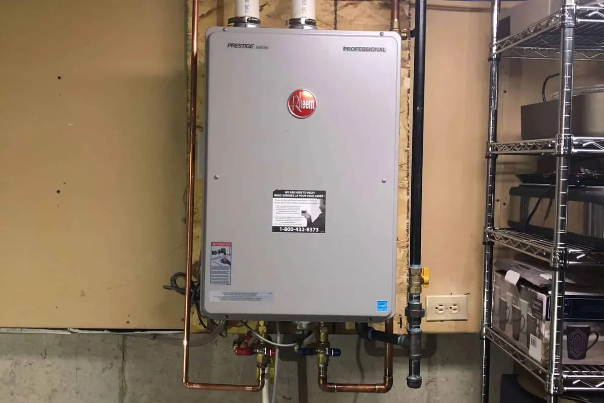 Rheem tankless water heater installed on a wall in a Tampa basement