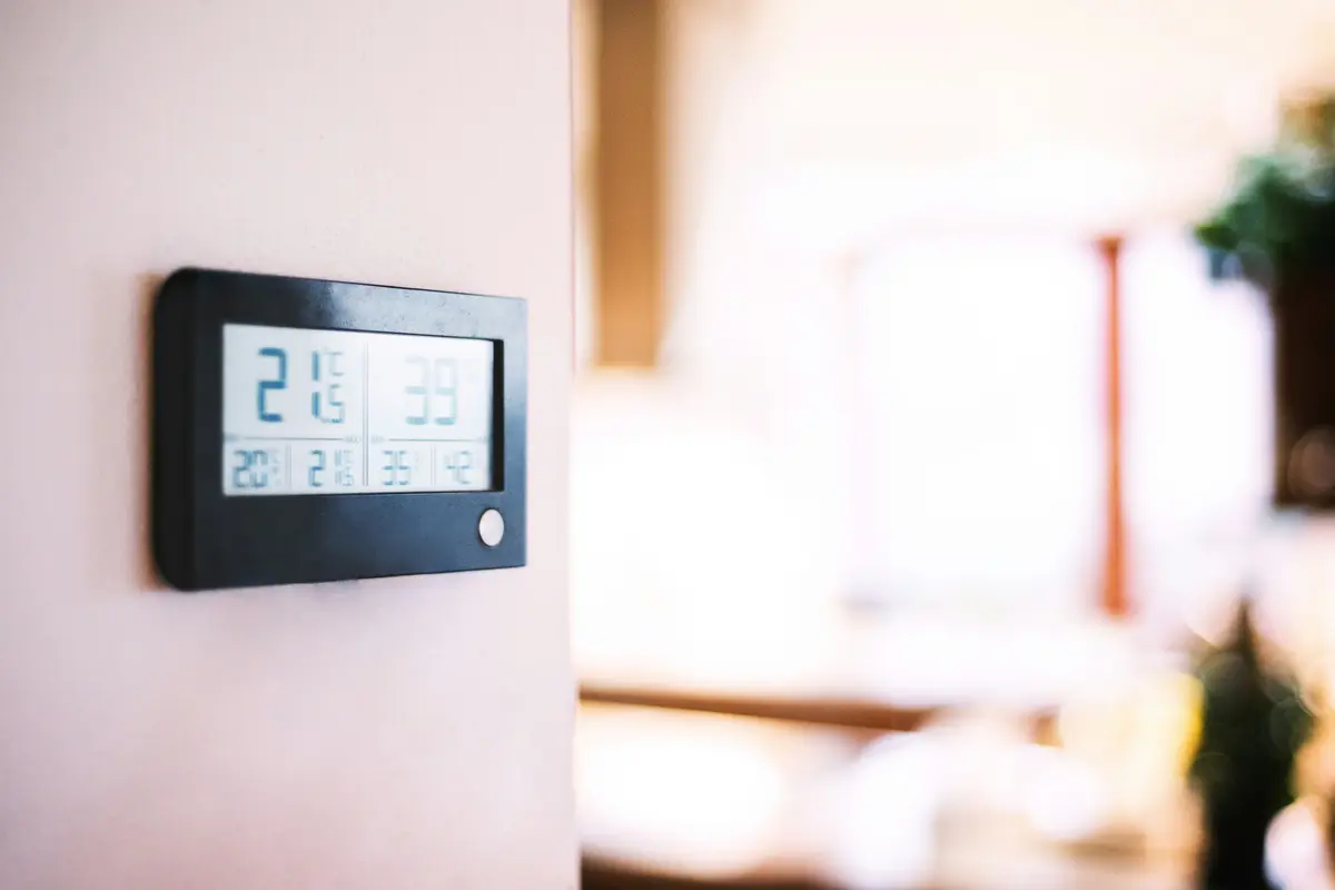 Modern smart thermostat on a residential wall in Tampa